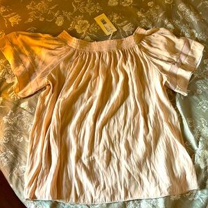 Off the shoulder silky blouse.